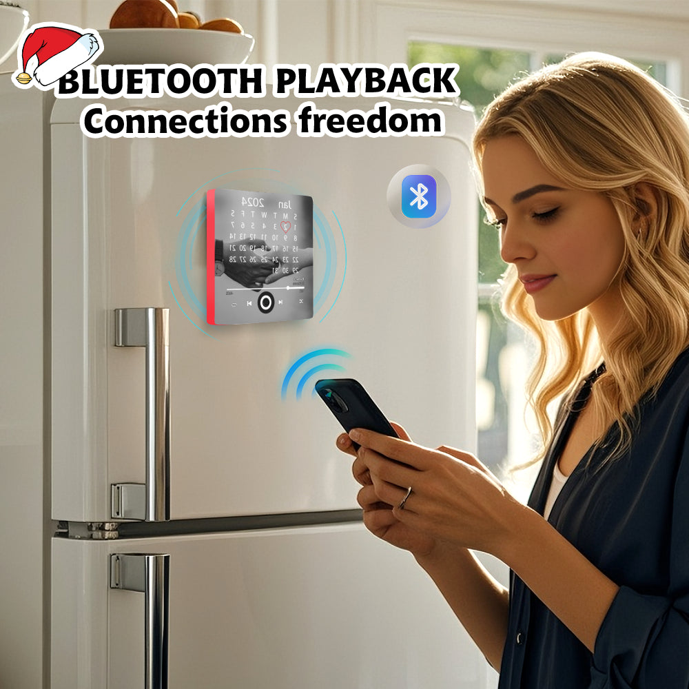 Blond woman standing in front of a white refrigerator holding a smartphone near the custom music player fridge magnet.