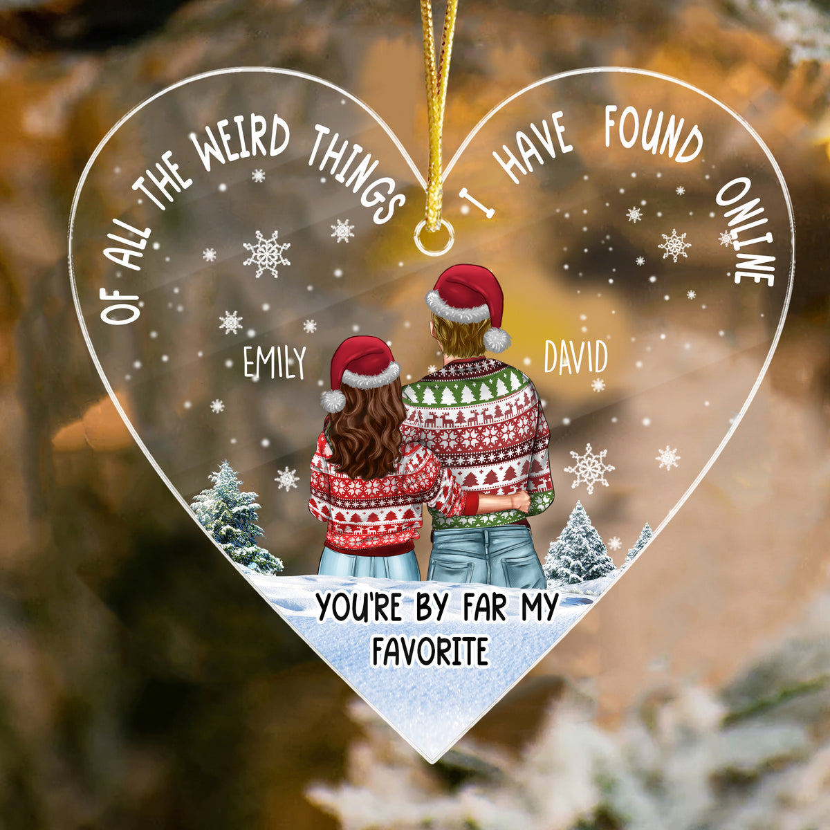 Heart-shaped clear acrylic ornament featuring a couple in sweaters and Santa hats amidst snowy trees, perfect for