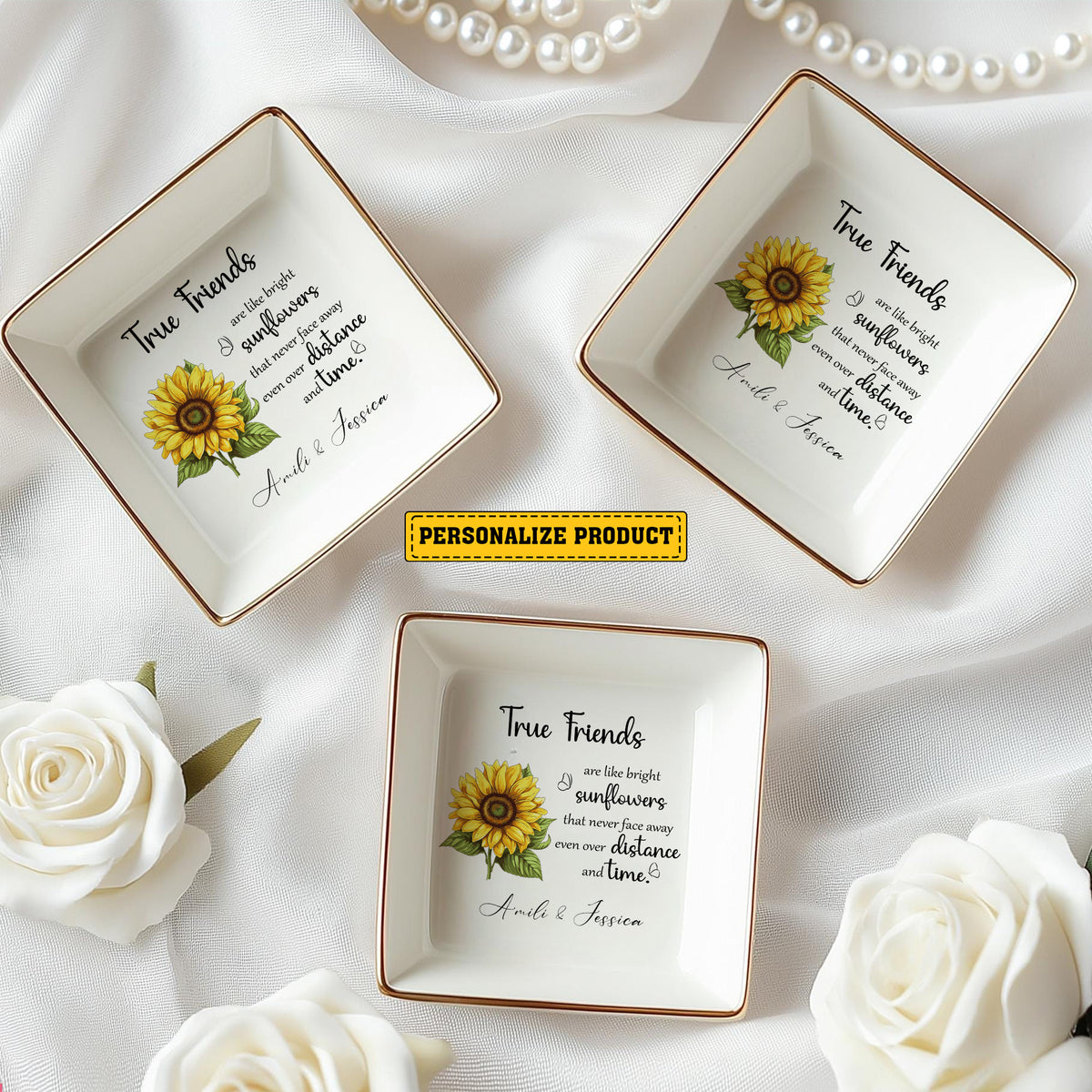 Three custom friends ring dishes with sunflower designs, gold rims, and white roses surrounding them.