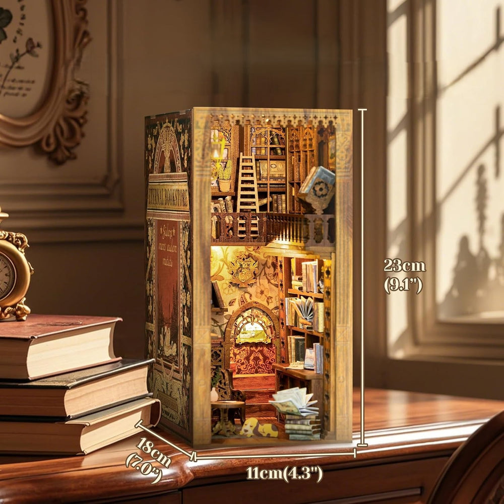 Fully assembled miniature bookstore kit showing dimensions of 23cm height, 18cm depth, and 11cm width.