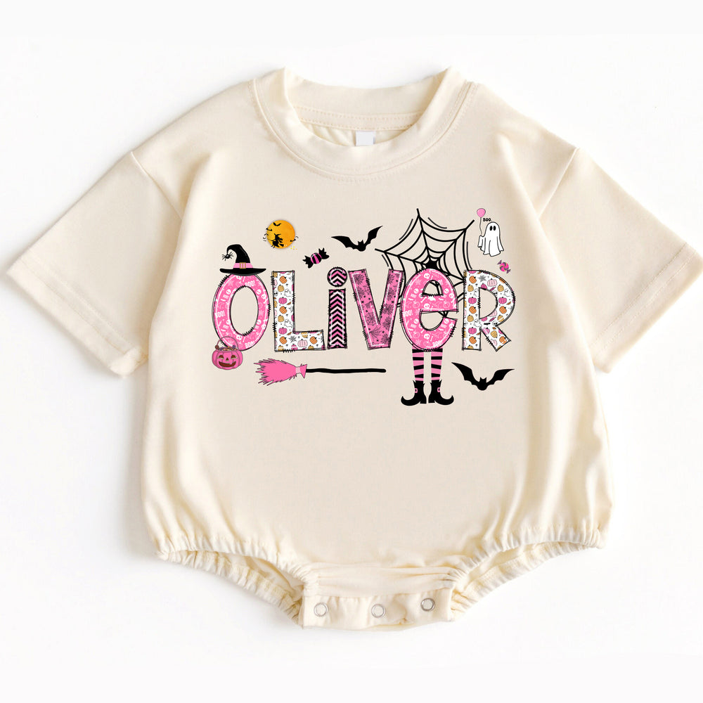 Personalized kids Halloween baby romper in cream with short sleeves and a custom OLIVER name print featuring cute Halloween
