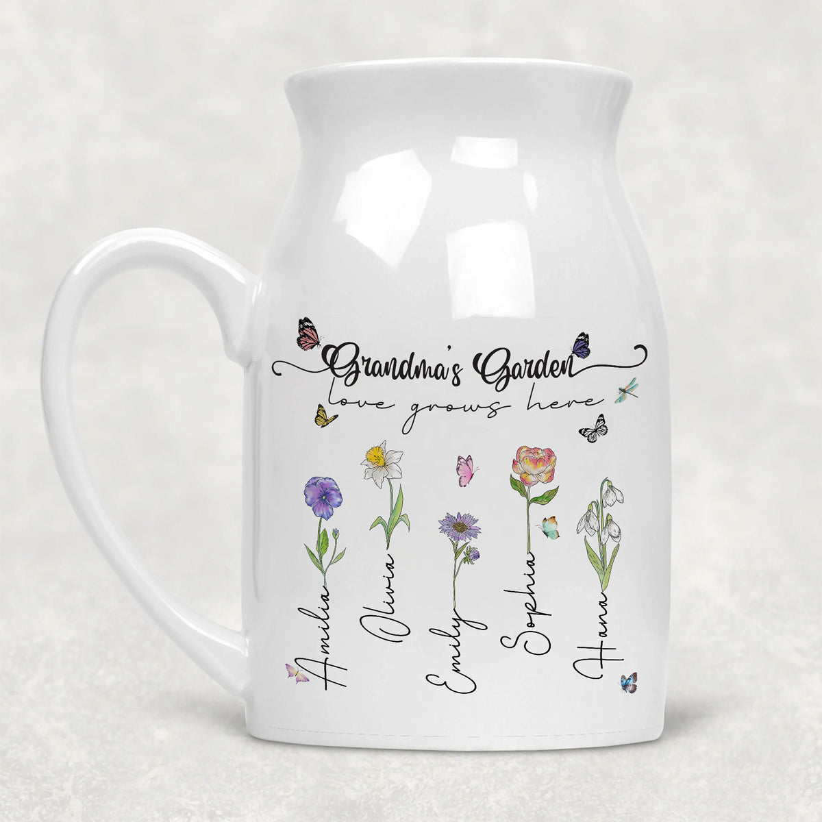 White ceramic vase with handle featuring Grandma's Garden text, birth flowers, and children's names.
