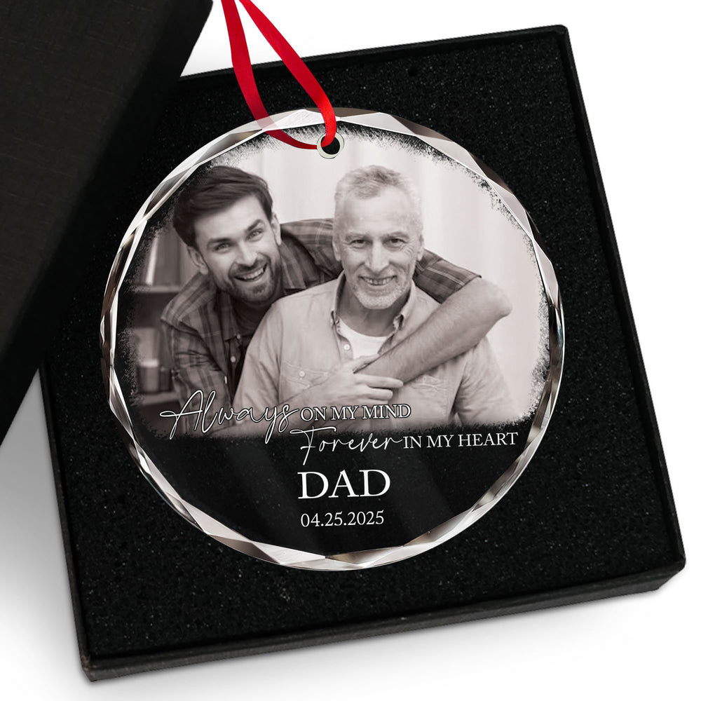 Custom photo glass ornament for dad inside a black gift box lined with foam and a red ribbon.