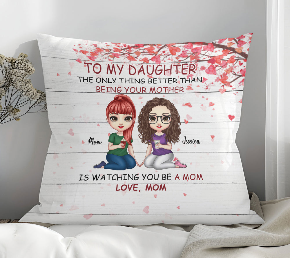 Personalized To My Daughter pillow with cartoon mom and daughter sitting beneath a pink heart tree on white wood print.