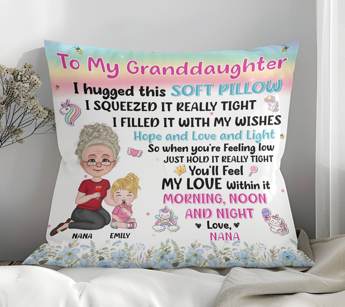 Square personalized pillow on a bed with I Hugged This Soft Pillow quote, cartoon grandma and granddaughter.