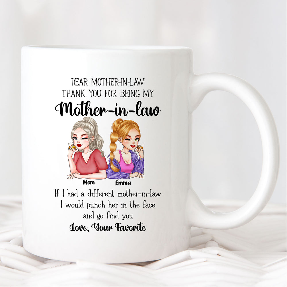 White ceramic mother in law mug displayed upright on a textured white woven fabric background.