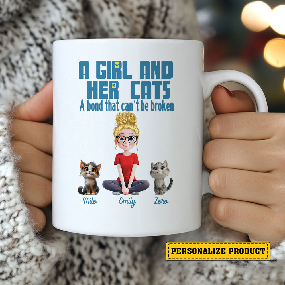 Custom cat lover gift ceramic mug held by hands wearing a cozy sweater with warm holiday lights blurred in background.
