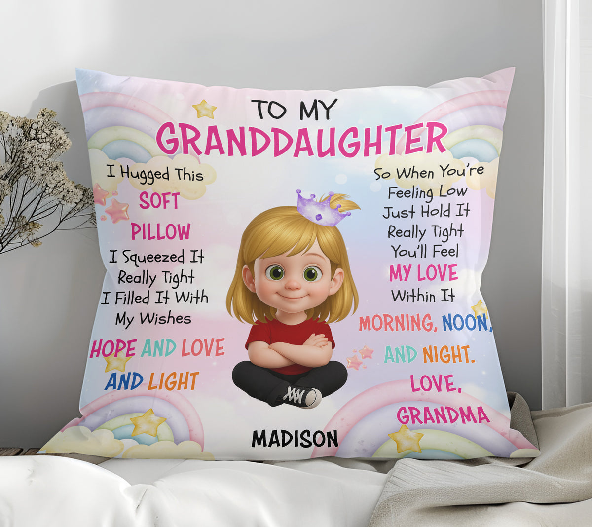 Personalized flannel pillow for granddaughter on white bedding, pastel rainbow and cloud design with cartoon girl.