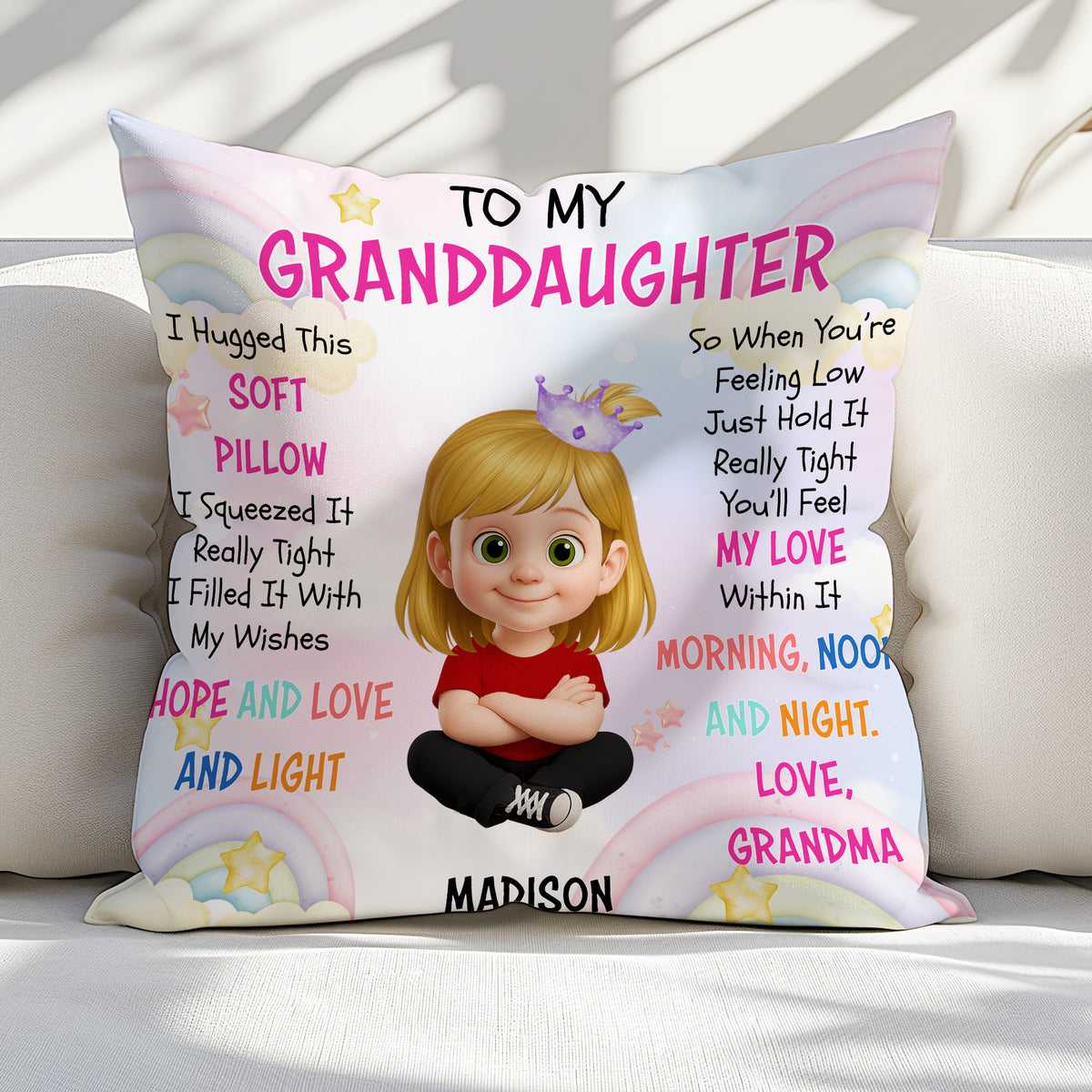 Gift for granddaughter personalized pillow resting on a light sofa, showcasing rainbow print and granddaughter name.