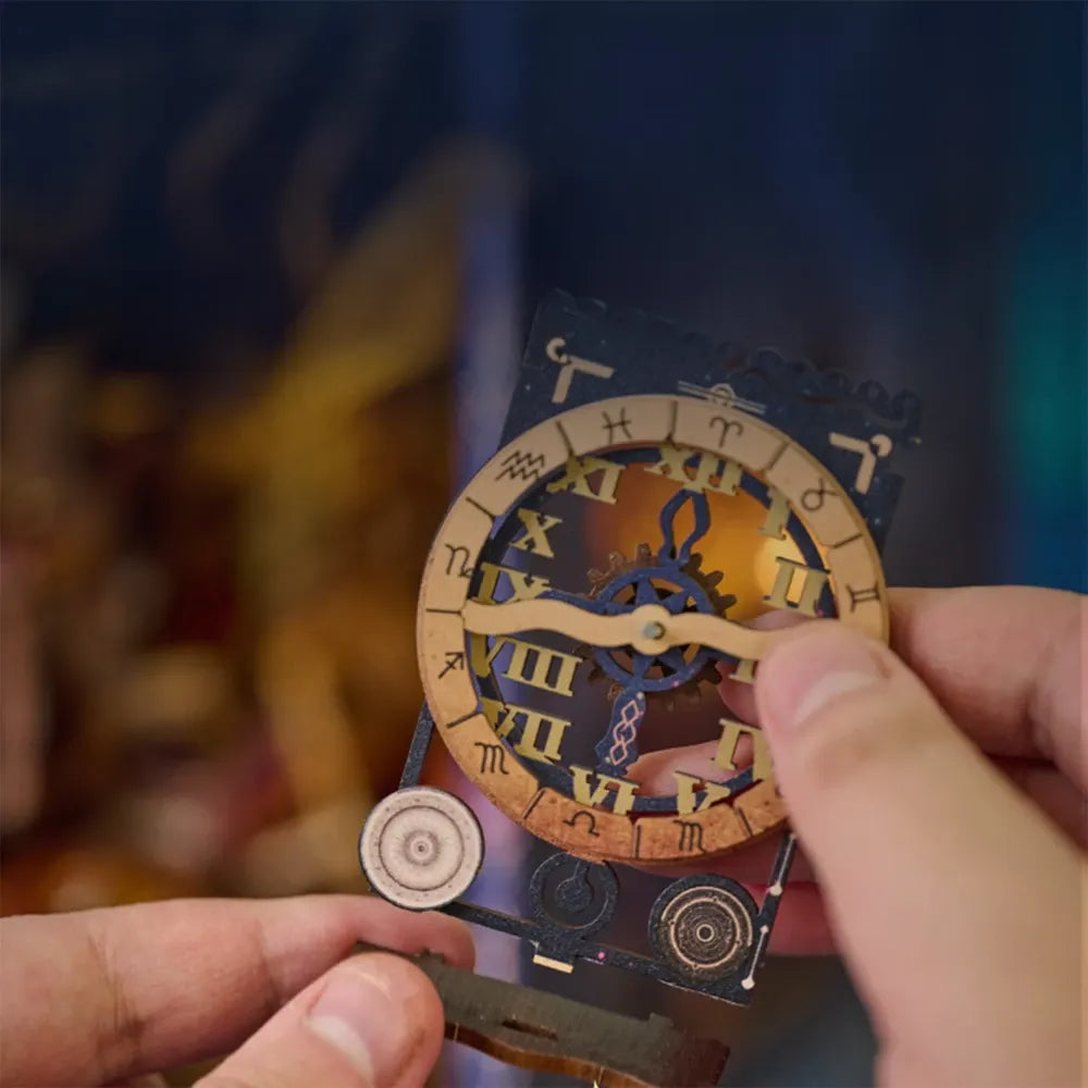 Close-up of assembling the zodiac clock puzzle piece for the magical laboratory miniature kit