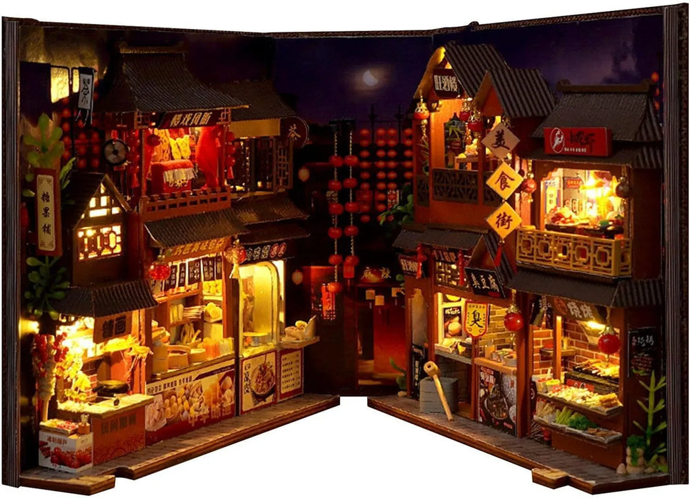 Full wide view of the illuminated miniature Chinatown food court book nook puzzle with detailed street stalls.