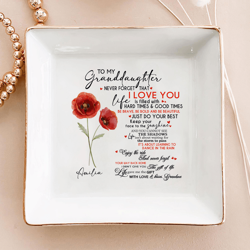 White square ceramic ring dish with hand-painted gold rim, featuring red poppy flowers and a personalized granddaughter