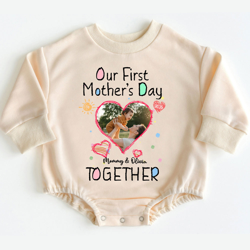 Beige long-sleeve baby romper featuring Our First Mother's Day Together print, custom photo, and colorful lettering.