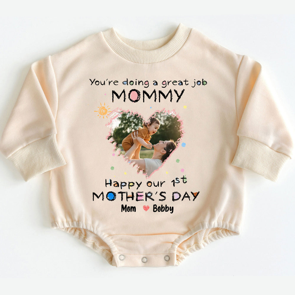 Beige long-sleeve baby romper featuring a heart-shaped photo print and Mommy text laid flat.