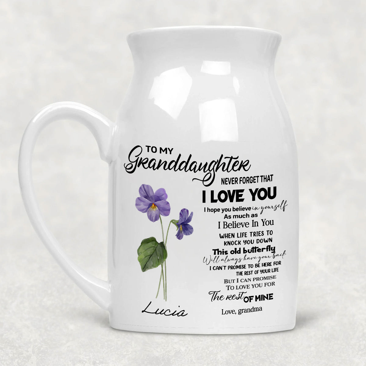 Personalized granddaughter flower vase in white ceramic featuring purple birth month flowers and a sentimental quote.