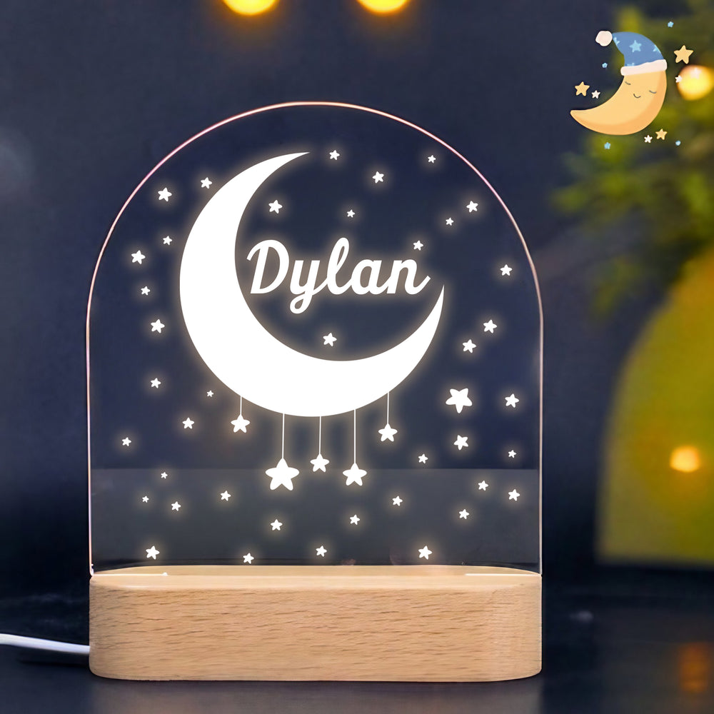 Personalized romantic LED night lamp glowing with warm white light, showing a crescent moon design and dangling stars against