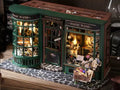 Model of a magical wand shop with illuminated interior and detailed exterior.