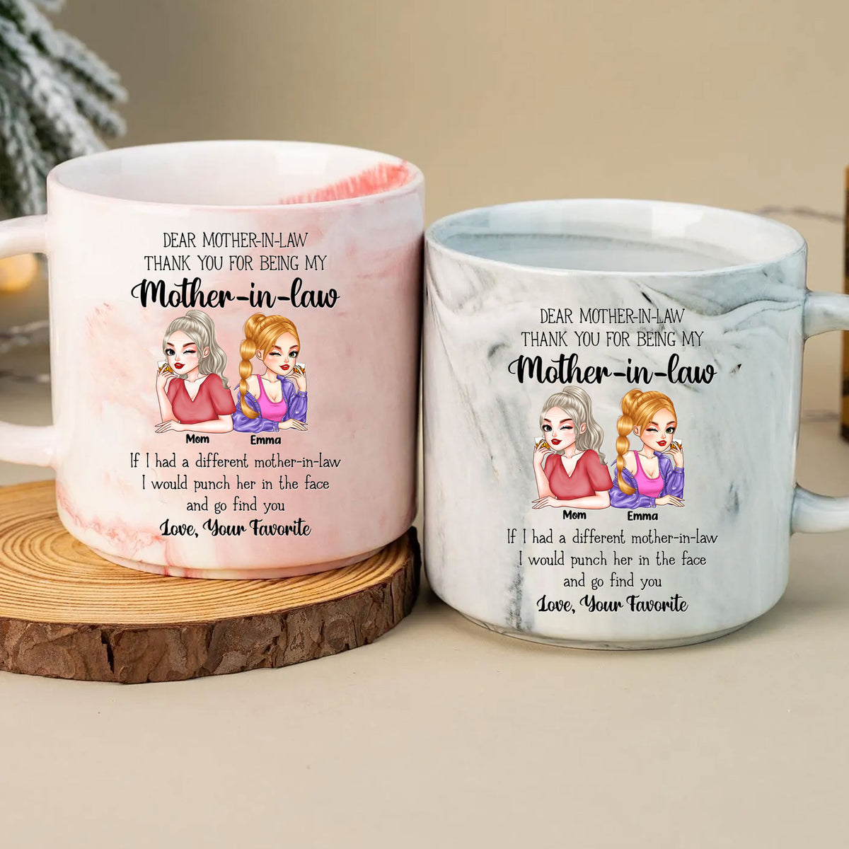 Pink and grey marble mugs placed on a wooden coaster with custom illustration and funny message for mother-in-law.