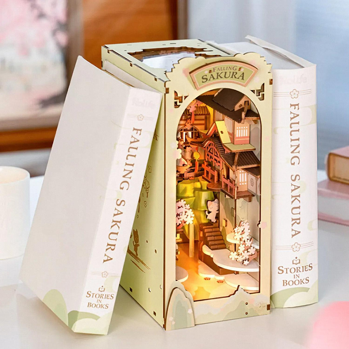 Dollhouse in a book-shaped box with 'Falling Sakura' branding